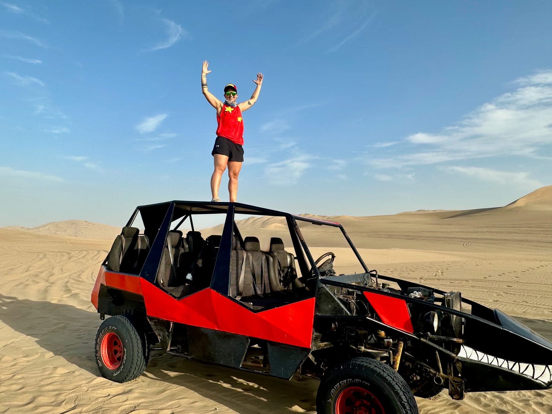 Standing on a dune buggy at Huacachina Oasis, Peru